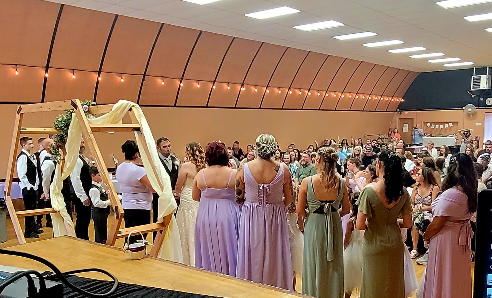 Wedding ceremony with gold arch